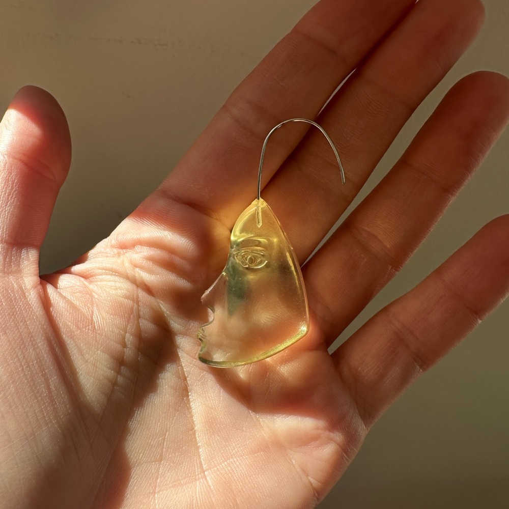 Mango face shape plastic earrings